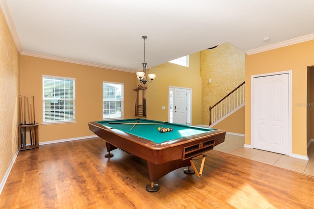 rec room with crown molding, hardwood / wood-style floors, pool table, and a healthy amount of sunlight