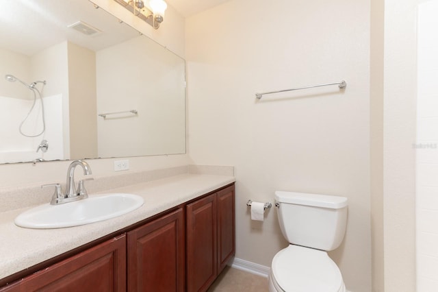 bathroom with walk in shower, vanity, and toilet