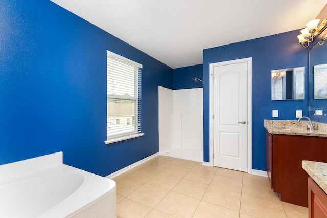 bathroom with vanity, tile patterned floors, and a bathtub