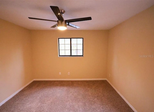 empty room with carpet floors and ceiling fan