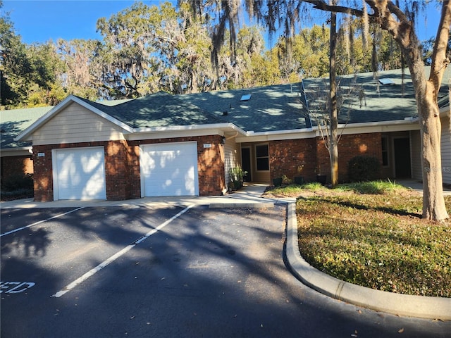 single story home with a garage