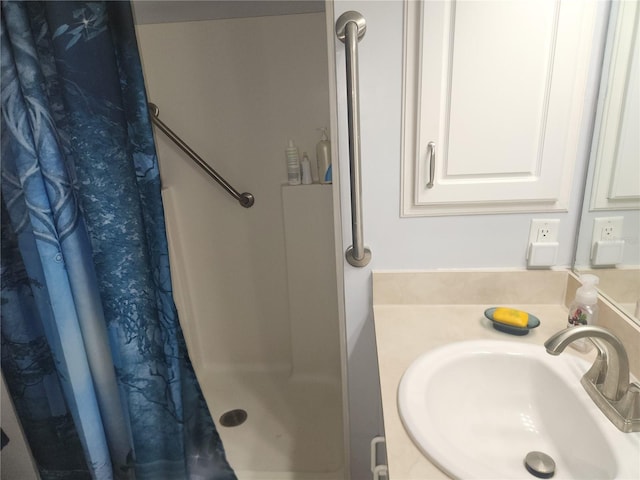 bathroom with sink and a shower with curtain