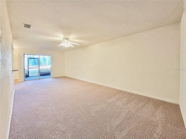 empty room with ceiling fan and carpet flooring