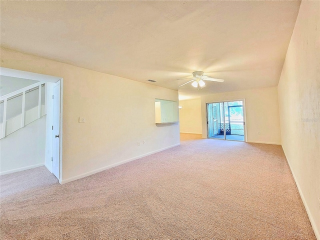 empty room featuring ceiling fan and carpet floors