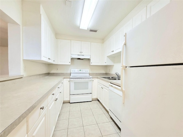 kitchen with white cabinetry, white appliances, sink, and light tile patterned floors