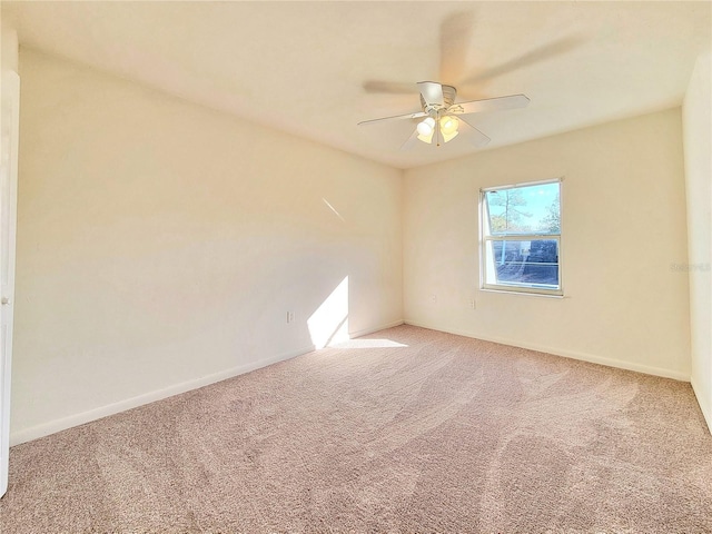 empty room with carpet and ceiling fan