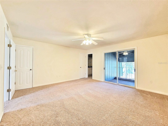 unfurnished room featuring light colored carpet and ceiling fan