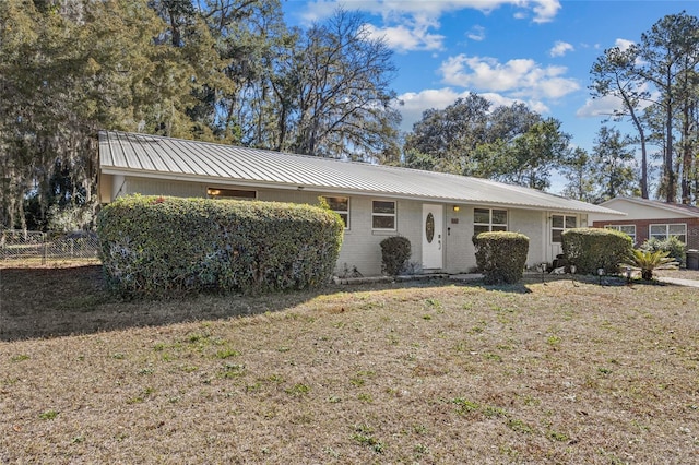 ranch-style home with a front yard