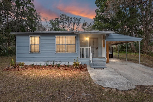 view of front of house with a carport