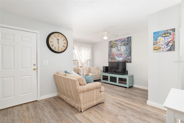 living room with ceiling fan and wood-type flooring