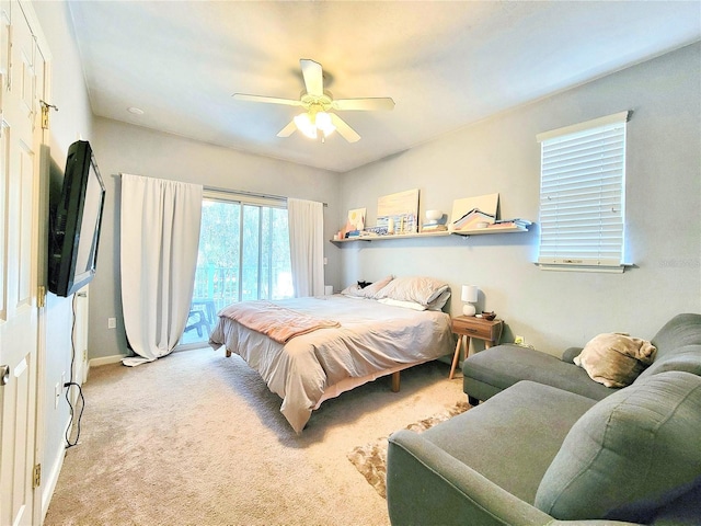 bedroom featuring light colored carpet and ceiling fan