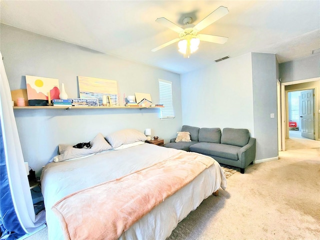 bedroom with ceiling fan and carpet flooring