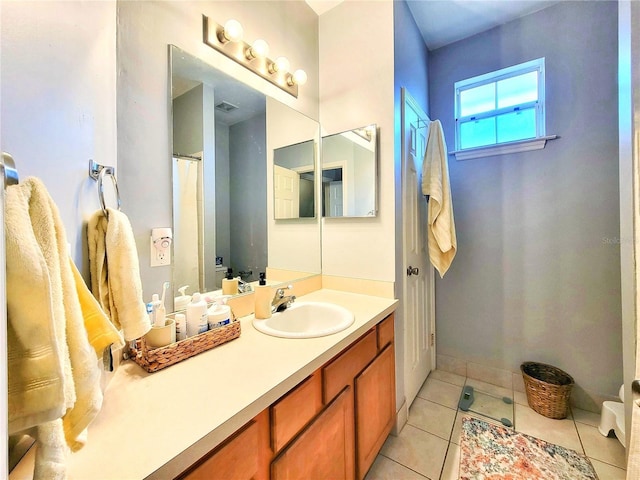 bathroom featuring tile patterned floors and vanity