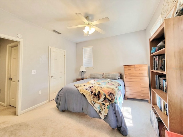 carpeted bedroom featuring ceiling fan