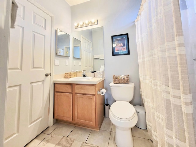 bathroom with vanity, tile patterned floors, and toilet