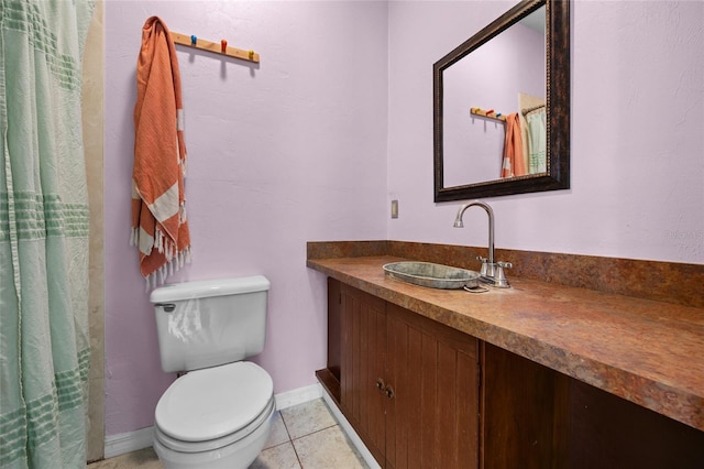 full bathroom featuring vanity, tile patterned floors, toilet, and baseboards