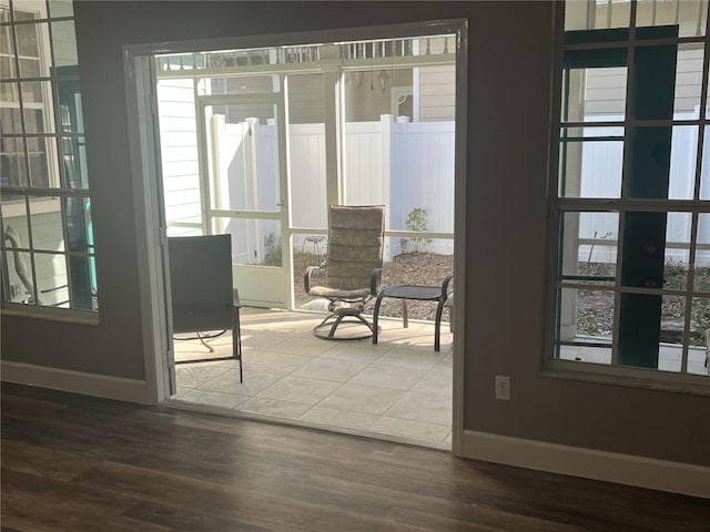 doorway with dark wood-type flooring