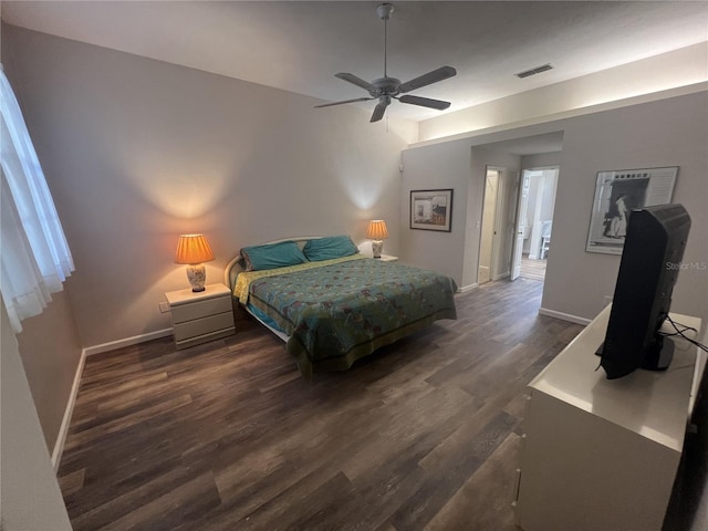 bedroom with ceiling fan and dark hardwood / wood-style flooring