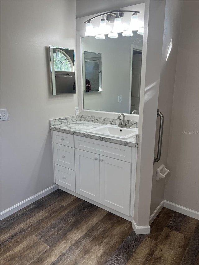 bathroom with vanity and hardwood / wood-style flooring