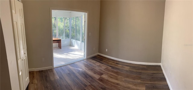 empty room featuring dark hardwood / wood-style floors