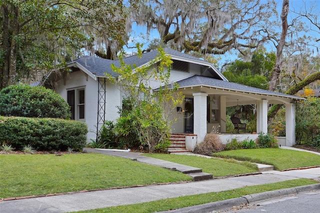 view of front of home with a front lawn