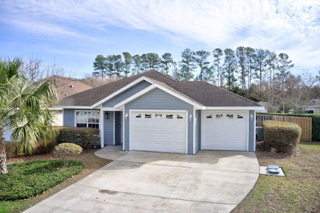 single story home featuring a garage and central air condition unit