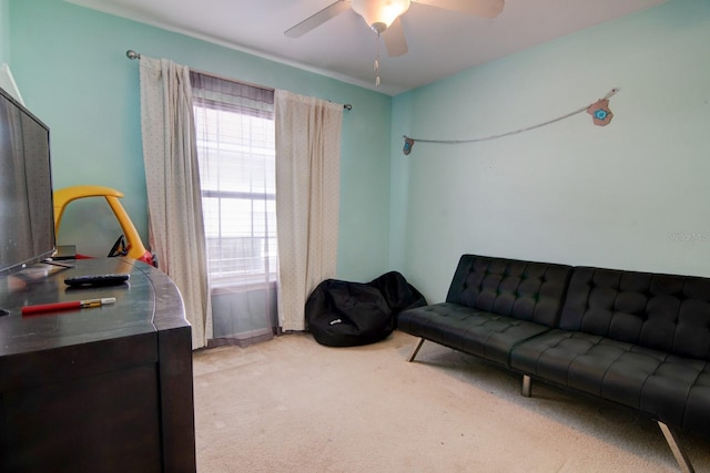 carpeted living room featuring ceiling fan