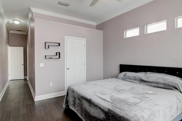 bedroom featuring ornamental molding, dark hardwood / wood-style floors, and ceiling fan