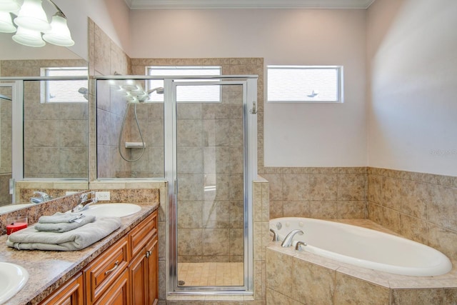 bathroom featuring independent shower and bath, vanity, and crown molding