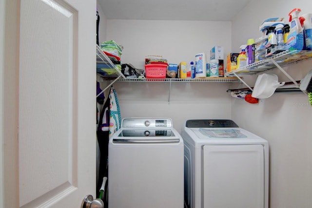 clothes washing area featuring washer and dryer