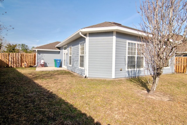 view of home's exterior with a lawn