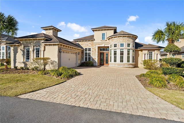 view of front of home with a garage and french doors