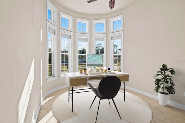 home office featuring light tile patterned floors and ceiling fan