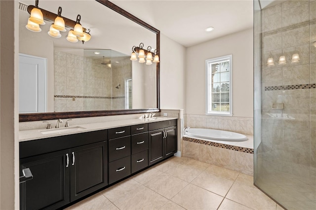 bathroom with vanity, tile patterned floors, and plus walk in shower