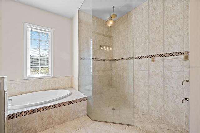 bathroom featuring independent shower and bath and tile patterned flooring