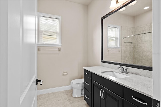 bathroom featuring vanity, toilet, and tile patterned flooring