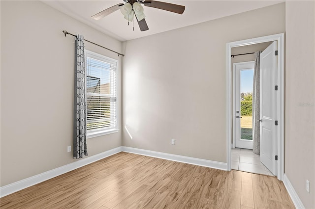 spare room with light hardwood / wood-style floors and ceiling fan