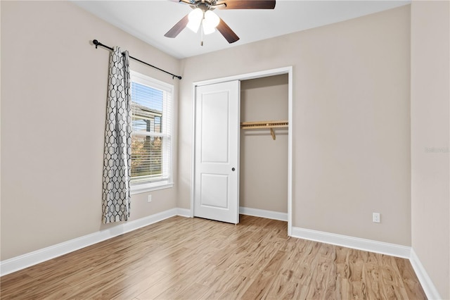 unfurnished bedroom with a closet, ceiling fan, and light hardwood / wood-style flooring