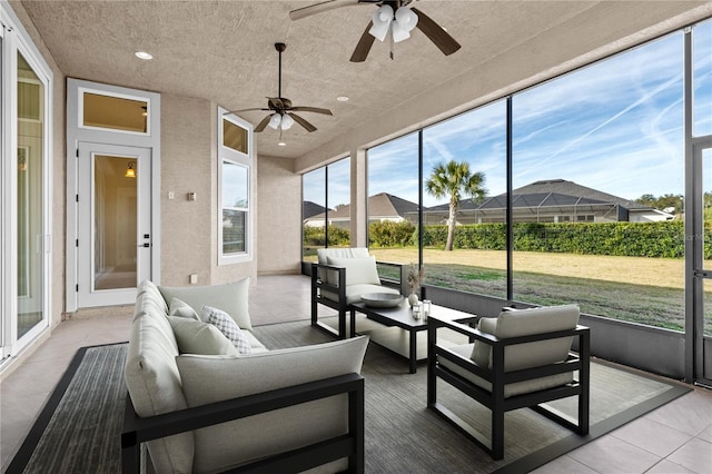 sunroom with ceiling fan