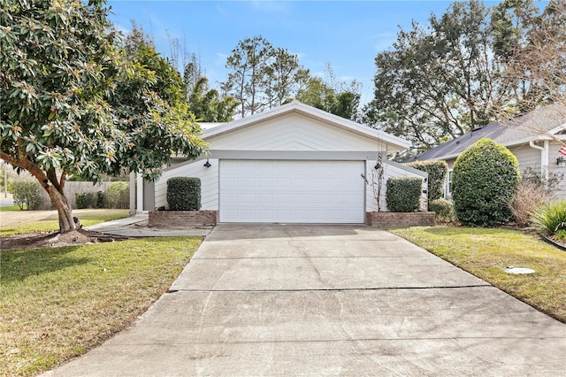 view of front facade with a garage and a front lawn