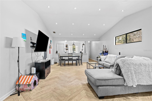 living room with vaulted ceiling and light parquet floors