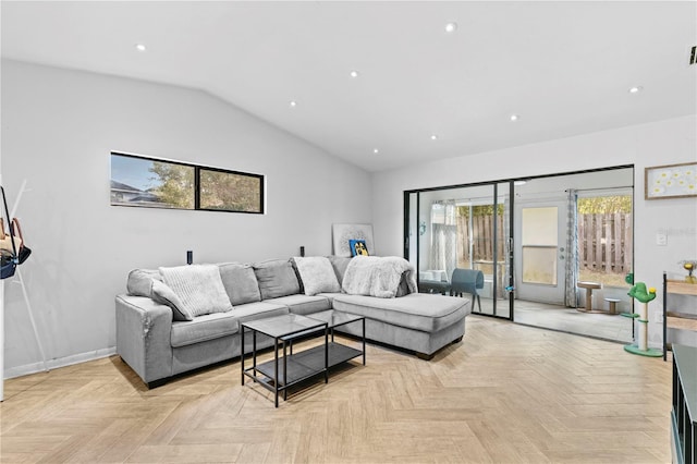 living room with light parquet floors and lofted ceiling