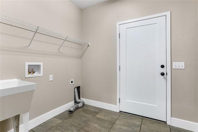 washroom featuring electric dryer hookup, washer hookup, and sink