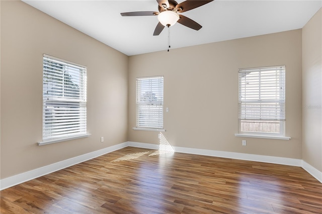 empty room featuring hardwood / wood-style floors and ceiling fan