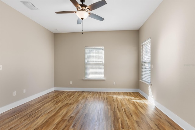 spare room featuring ceiling fan and light wood-type flooring