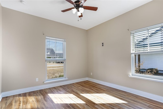 unfurnished room featuring ceiling fan and light wood-type flooring