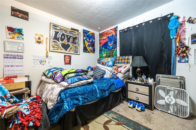 bedroom featuring a textured ceiling and carpet