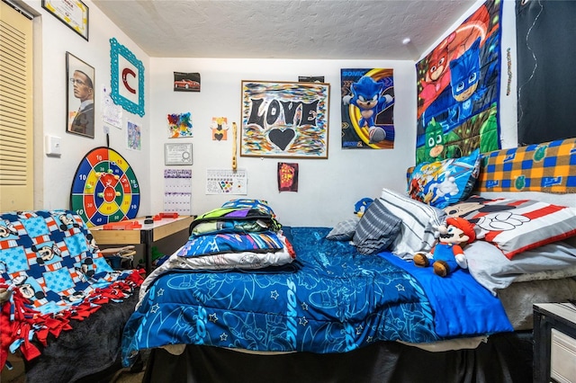 bedroom featuring a textured ceiling