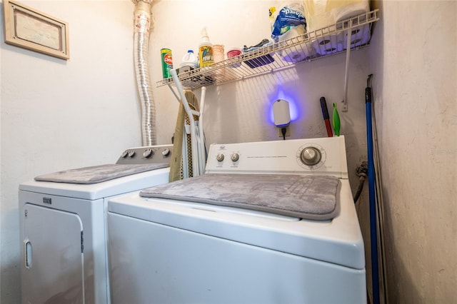 laundry room with separate washer and dryer