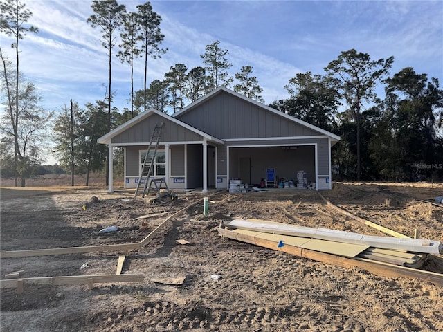 view of front of home featuring a garage and covered porch